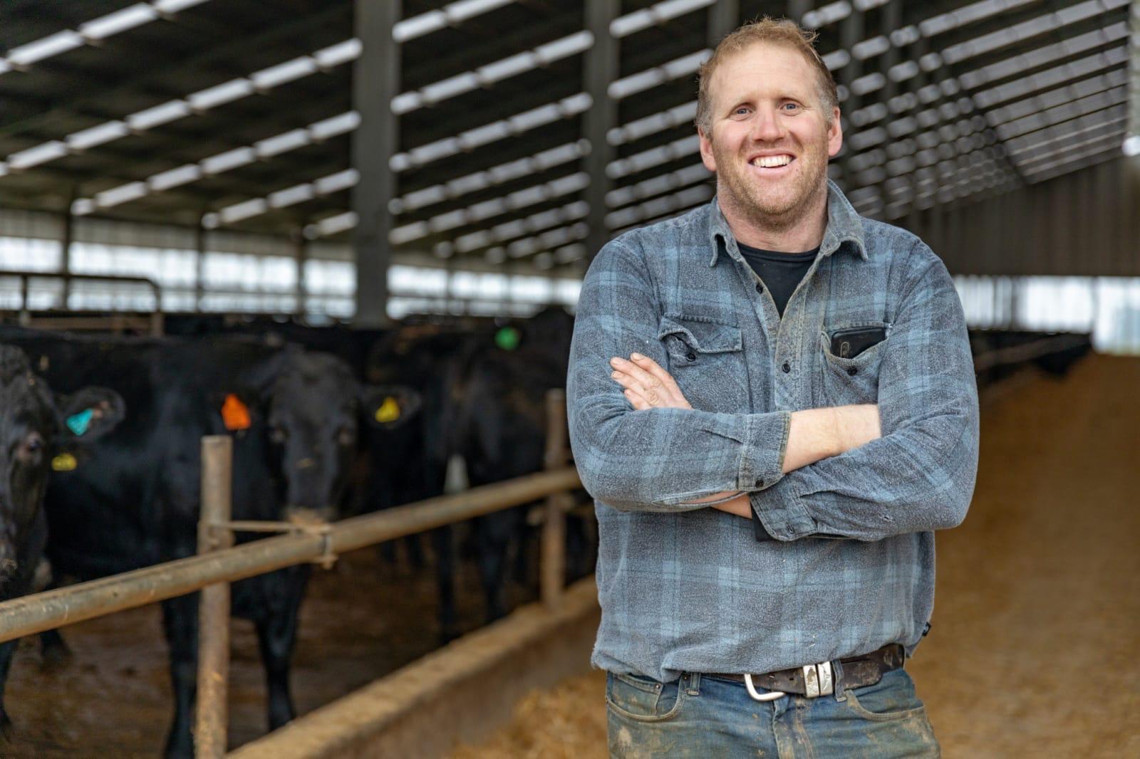 Black Origin farmer inside the cattle facility
