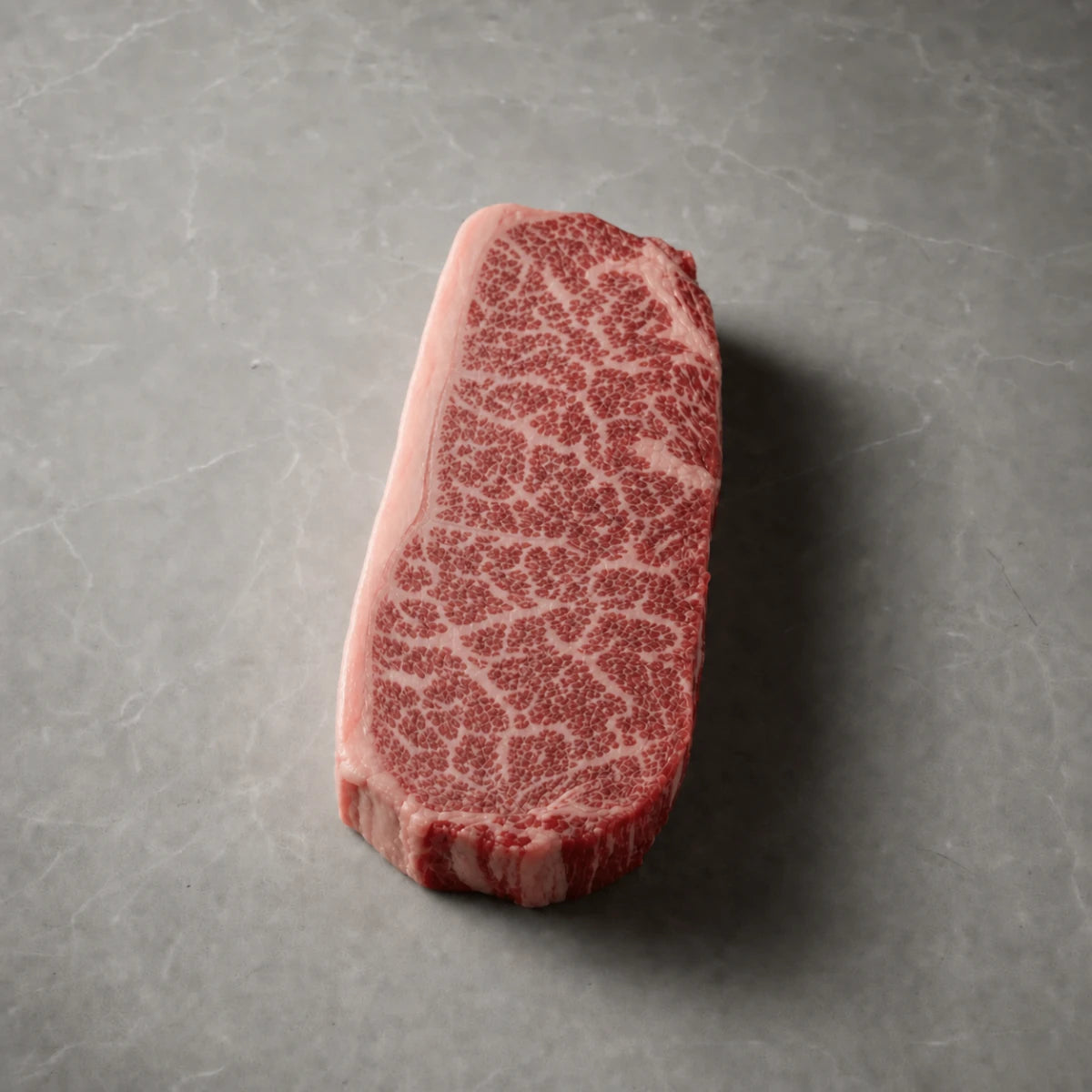 New York Strip steak showing BMS 8-9 marbling